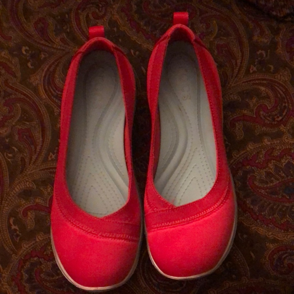 Red Croc foot ware.